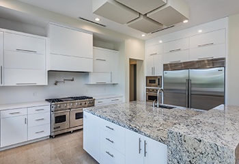 Custom kitchen design featuring a large island and high-end appliances in Palos Verdes Estates